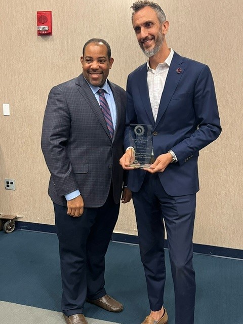 Pictured l-r: FDOE K-12 Chancellor Dr. Paul Burns, 2024 Principal of the Year Dr. Michael George