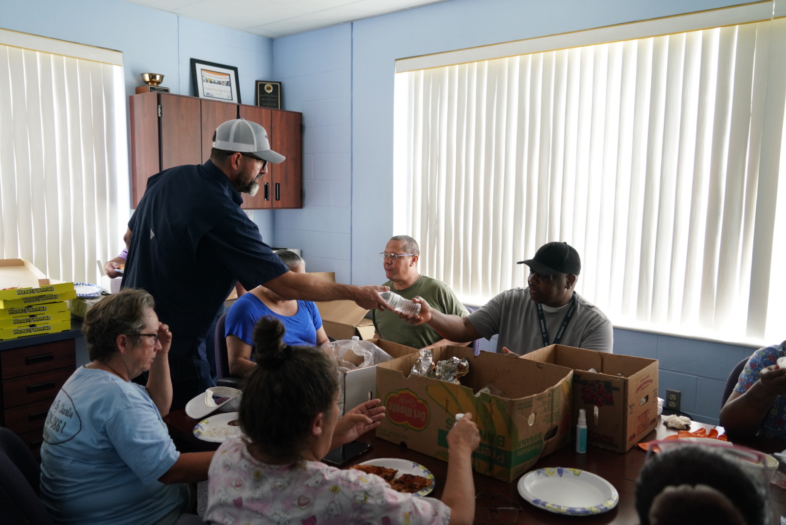 Commission Diaz helps staff from Cedar Key School in Levy County.