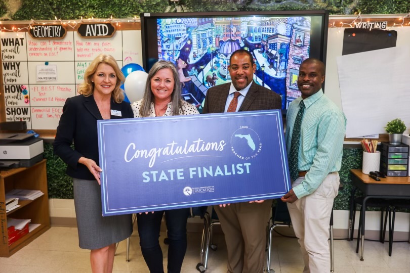 In photo (l-r): Marion County Schools Superintendent Diane Gullet; Jennifer Brown; FDOE Public Schools Chancellor Dr. Paul Burns; Forest High School Principal Lamar Rembert