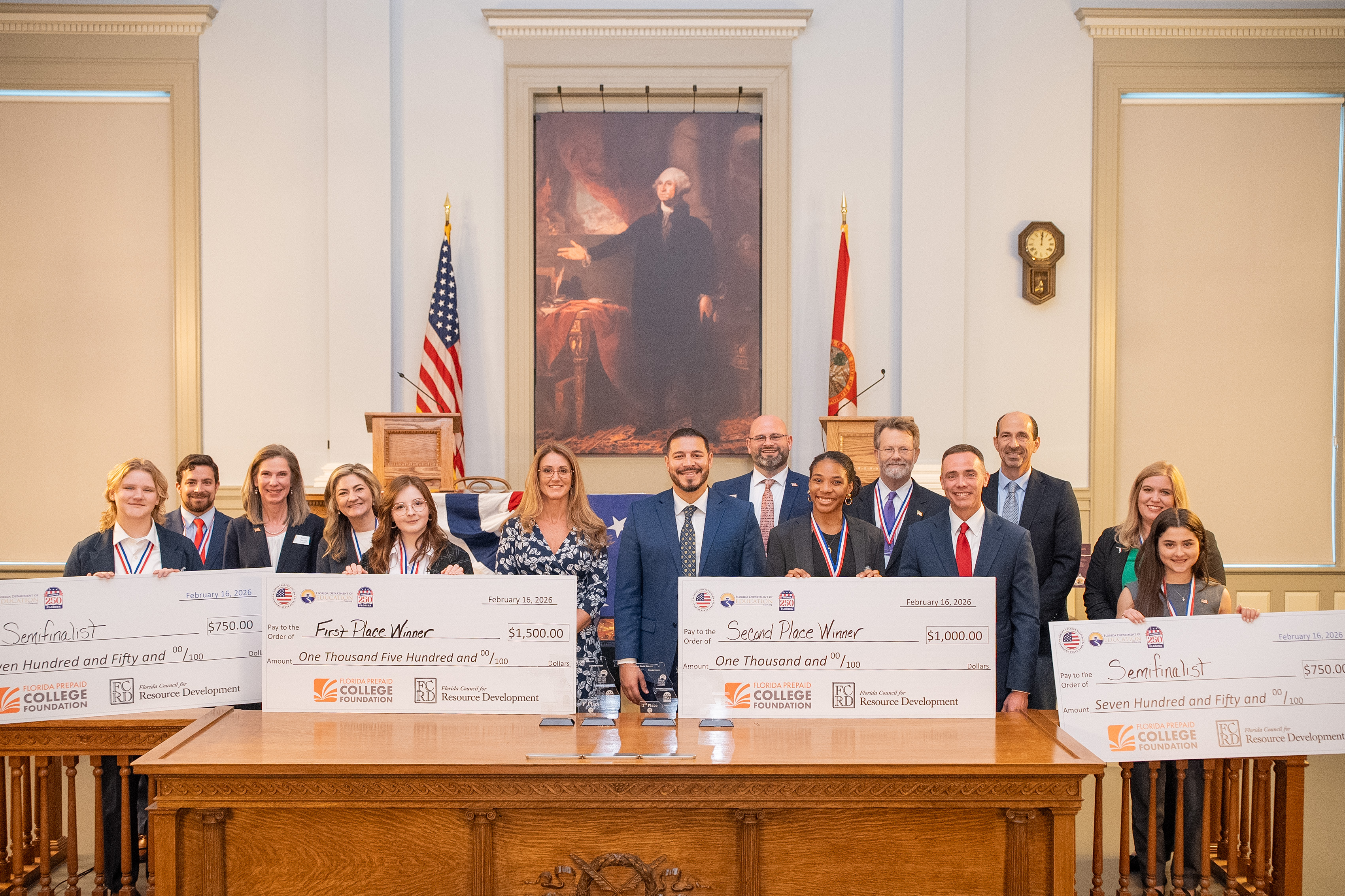 Commissioner of Education Anastasios Kamoutsas joins 2026 Florida Teacher of the Year Mark Harrison and sponsor representatives in recognizing the Sunshine State Debate finalists and semifinalists.